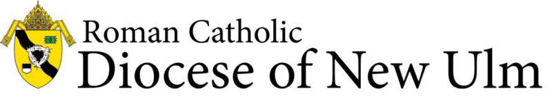 The logo of the Roman Catholic Diocese of New Ulm showcases a yellow and black shield adorned with religious symbols and text on the right, reflecting its dedication to Catholic colleges and youth groups.