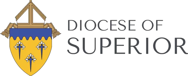 Logo of the Diocese of Superior, featuring a shield with a gold background and three blue and white fleur-de-lis beneath a blue section with a church roof design, symbolizing its connection to Catholic colleges and Newman Ministry.